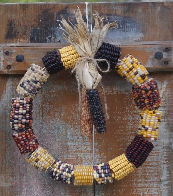 a super cool and simple corn cob wreath with a couple of corn cobs hanging down is a lovely and easy to DIY rustic decoration