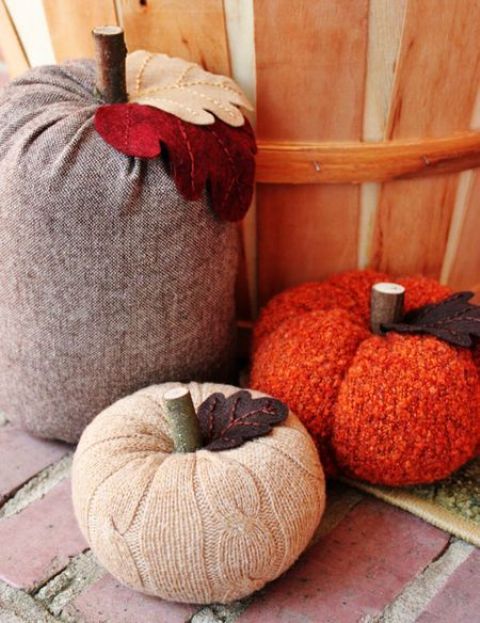 bright and neutral fabric pumpkins with stems and felt leaves are fun and cool for fall decor