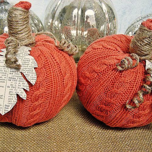 orange knit fabric pumpkins with newspaper leaves and twine stems are chic and stylish and will bring a bright touch to the space
