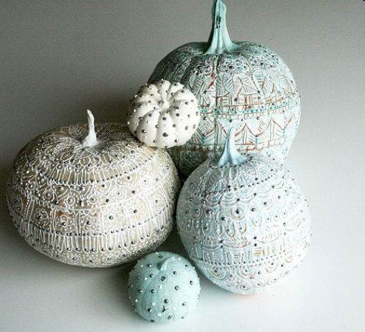 faux white and light blue pumpkins, painted in various patterns and with beads look refined and very elegant