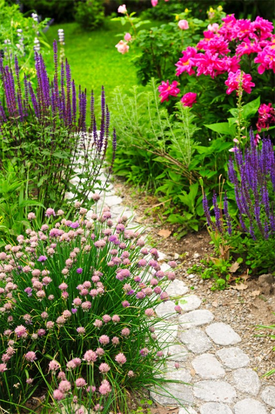 a simple and casual stone path with sand and gravel around is a proper idea for many gardens