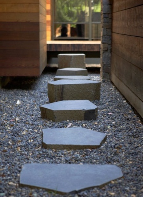 gravel and stones of various sizes, height and shapes add interest to the neutral and minimalist garden