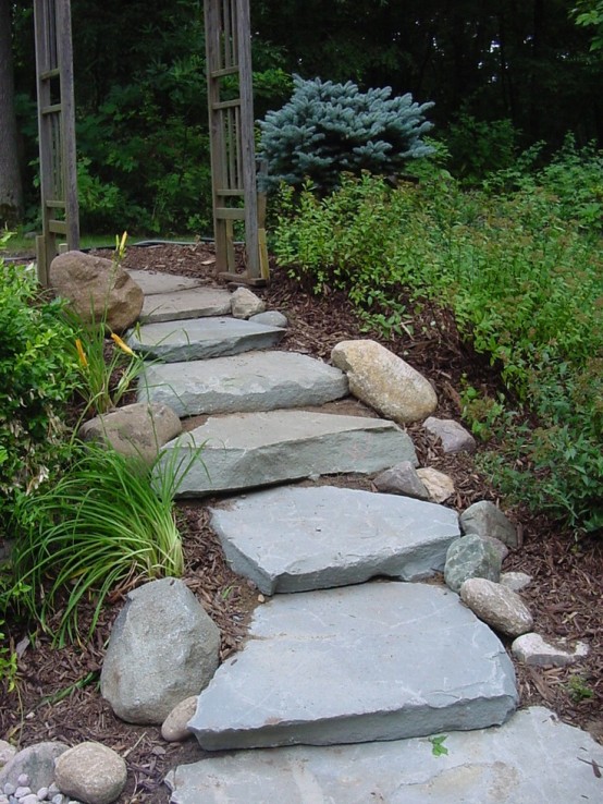 a rough path composed or large scale rough stones with smaller rocks that line up this path