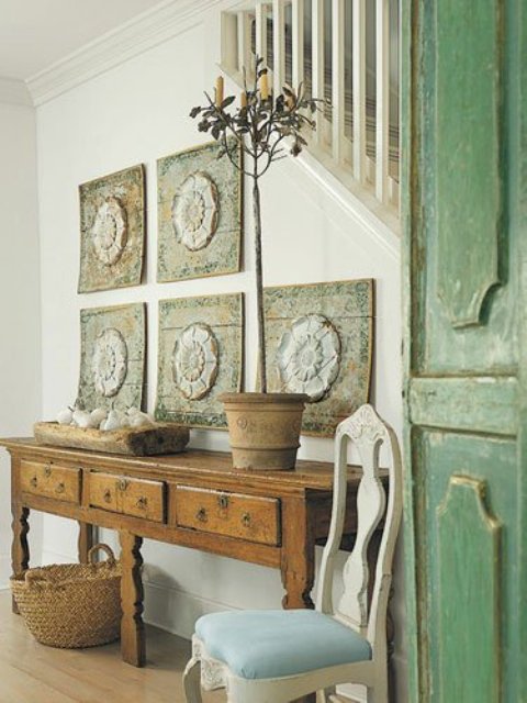 a dough bowl with white painted fake fruits is a cool farmhouse or rustic decoration