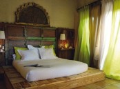 a platform bed instead of a usual one and a vintage carved headboard for a touch of boho