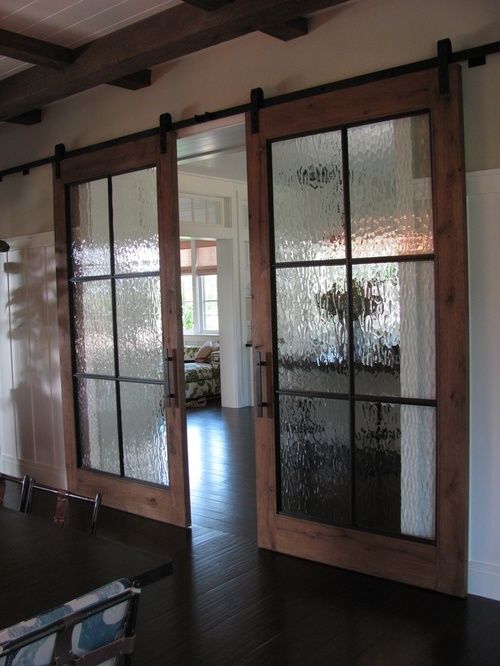 double sliding barn doors with rain glass will brign some privacy and a rustic touch