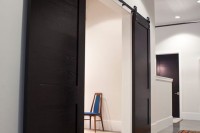 modern dark stained sliding doors contrast the interiors and make them look bolder