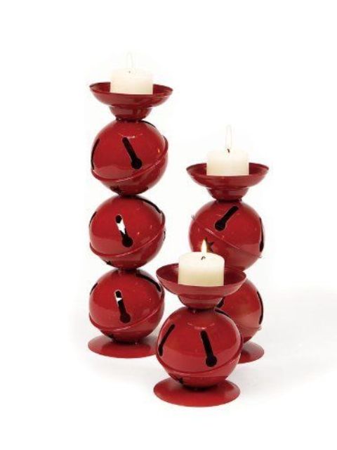 red bells stacked to create candleholders are cool and bright, they feel and look very Christmassy