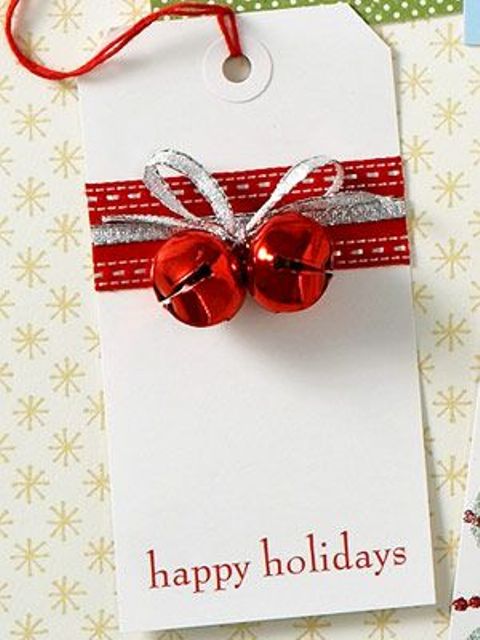 a gift tag with red and silver ribbons and red bells is a very lovely and chic idea for Christmas, add them to the gifts you are giving