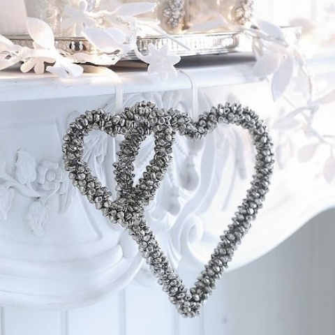 silver bells shaped into heart Christmas wreaths are amazing to accent your space for winter holidays, rock them wherever you want