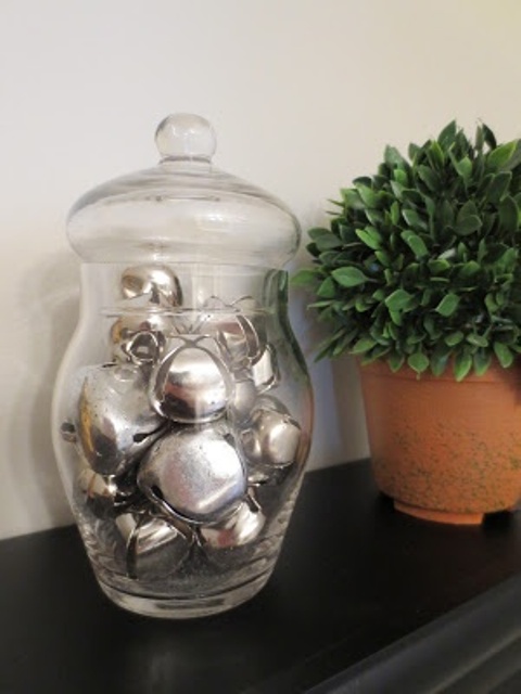 a glass jar with a lid filled with large silver bells is a cute Christmas decoration to rock and it can be made last minute