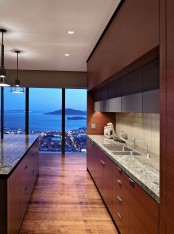 a wooden kitchen with a large wooden island