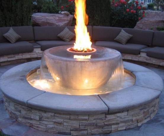 a spectacular fire bowl installed into a fountain is a gorgeous idea for a modern backyard, getting two elements in one