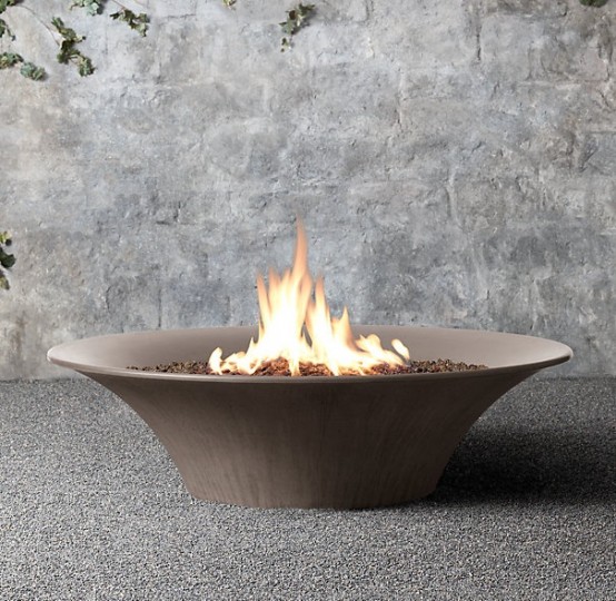 a plain metal fire bowl that resembles a plate is a great idea for a modern outdoor space, it looks spectacular and very chic