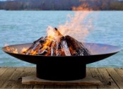 a metal fire bowl on a stand is always a good idea, vary the size according to your outdoor space size and shape