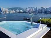a geometric outdoor jacuzzi with a fantastic harbor and big city view is a fabulous place to relax in, and these views are unforgettable