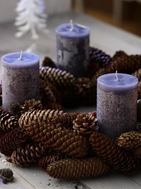 Here is a cool idea for a last minute Christmas centerpiece. It only takes 5 minutes to make one. Just place pinecones around candles and you're good to go. 