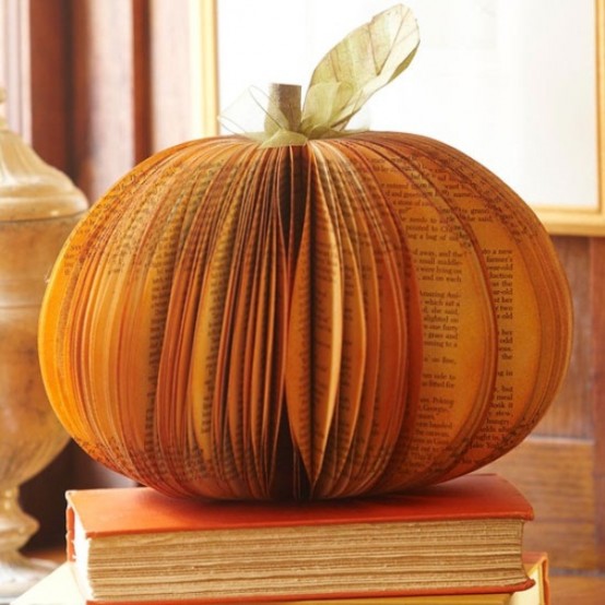 Awesome Pumpkin Centerpieces For Fall And Halloween Table For a DIY pumpkin centerpiece you can make a faux one using vintage book pages.