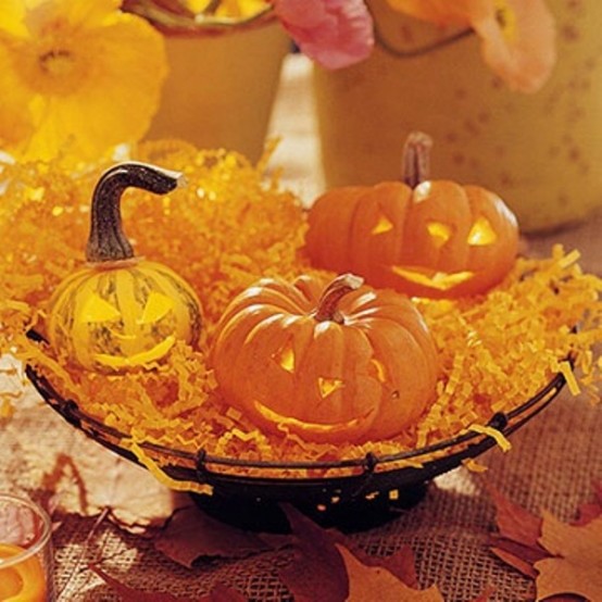 Awesome Pumpkin Centerpieces For Fall And Halloween Table Pumpkin lanterns could delightfully brighten up an evening affair. Works as for Halloween as for a casual Fall dinner.