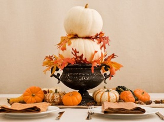 Awesome Pumpkin Centerpieces For Fall And Halloween Table Choose several flat-bottomed pumpkins in graduated sizes and put them in a bowl. Add some fall leaves and a gorgeous centerpiece is done.