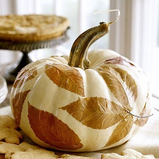 Awesome Pumpkin Centerpieces For Fall And Halloween Table Decoupage is a great technique to make anything look better. Cover the pumpkin in Mod Podge, place the leaves on it, and let dry. Another coat of Mod Podge would protect it for a long time.