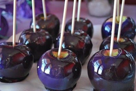purple candied apples are amazing for a Halloween party or they can be given as favors