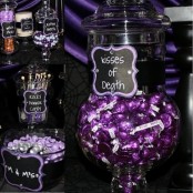 a black and purple sweets table with candies, desserts and sweets of various kinds is a gorgeous idea for a Halloween party