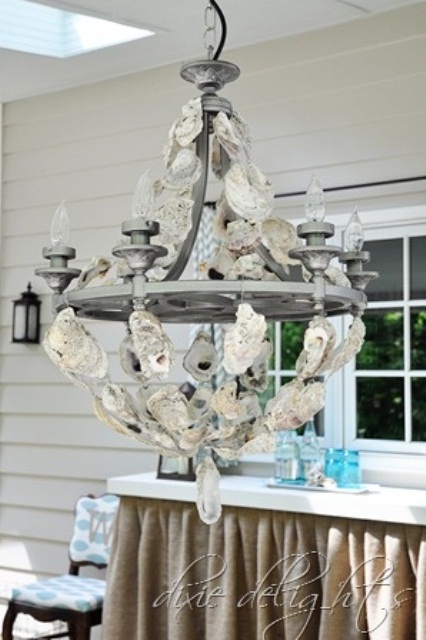 a vintage chandelier covered with seashells is a creative idea for a vintage beach home and it will finish off the space beautifully