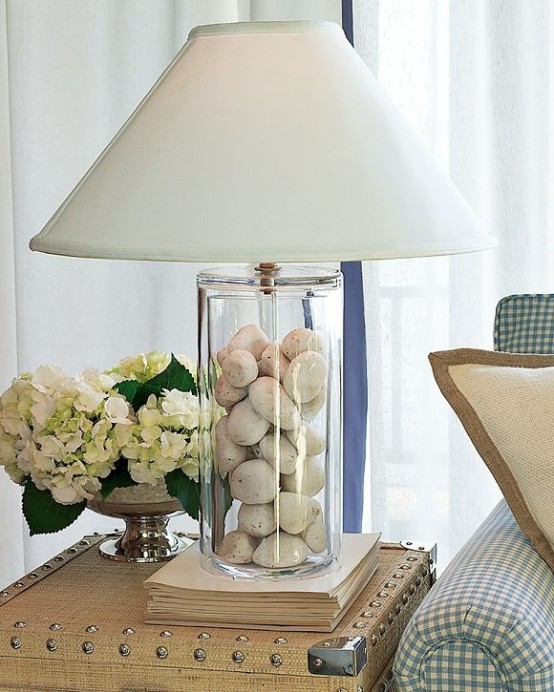 a stylish modern lamp with pebbles inside and a plain lampshade is a cool reminder of pebbly beaches and coasts