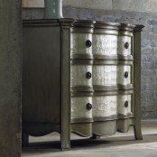 a refined metallic sideboard clad with mother of pearl looks very sophisticated and very chic