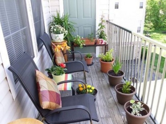 potted greenery and blooms, colorful printed pillows for a fresh spring touch in the balcony