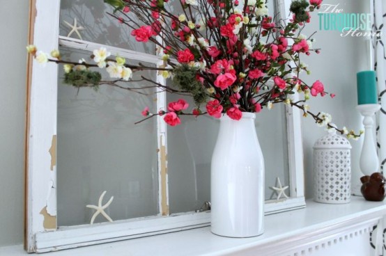 a summer mantel with bright blooms, a vintage window, starfish and turquoise candles
