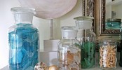 style your summer mantel with jars filled with starfish, seashells and sea glass of various colors