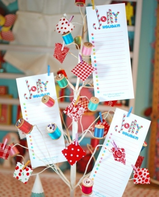 a tabletop craft Christmas tree with colorful spools and bold Christmas cards is a lovely idea for your craft room