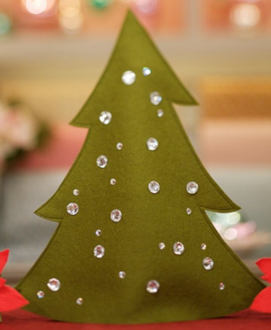 a green cardboard Christmas tree decorated with sparkling rhinestones as ornaments is a super cool craft to realize with kids or without