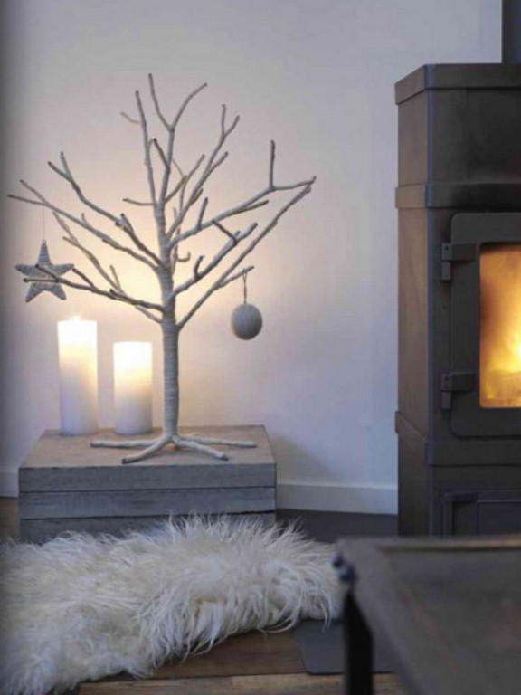 a white tree with a star and a bauble is a cool frozen idea for Christmas home decor