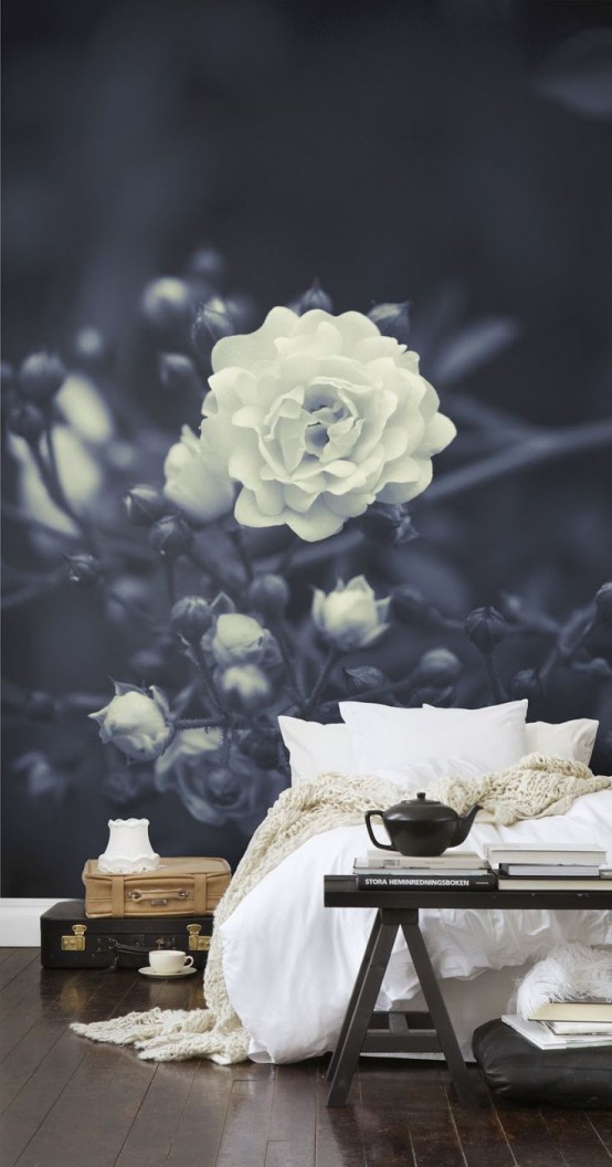 a monochromatic bedroom with a black and white floral wall mural that is elegant, chic and takes over the whole bedroom