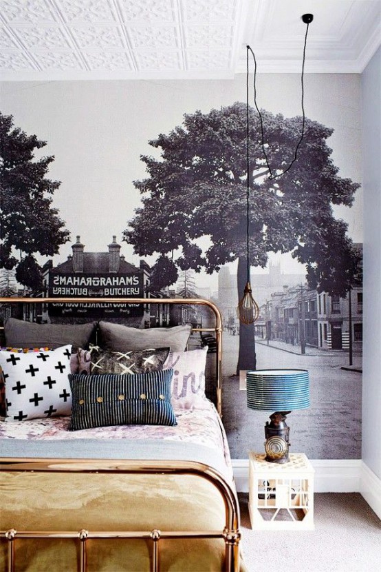 a black and white wall mural opposes the bold and bright furniture in the room and this combo looks cool