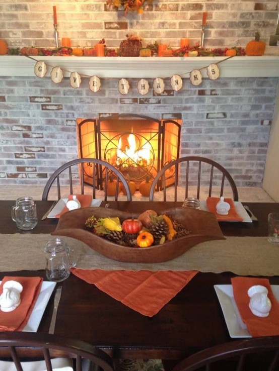 a whitewashed brick fireplace with a long mantel decorated for the fall will raise your dining space to a new level