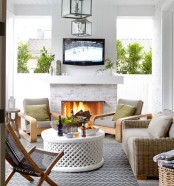 a whitewashed brick fireplace in a terrace will make your outdoor living room very cozy and very welcoming