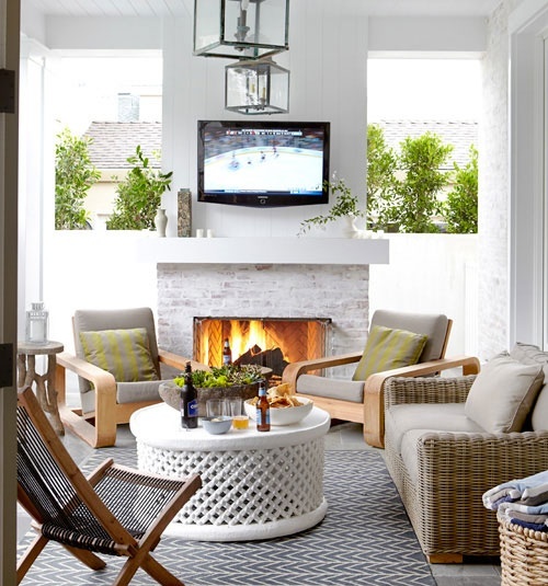 a whitewashed brick fireplace in a terrace will make your outdoor living room very cozy and very welcoming