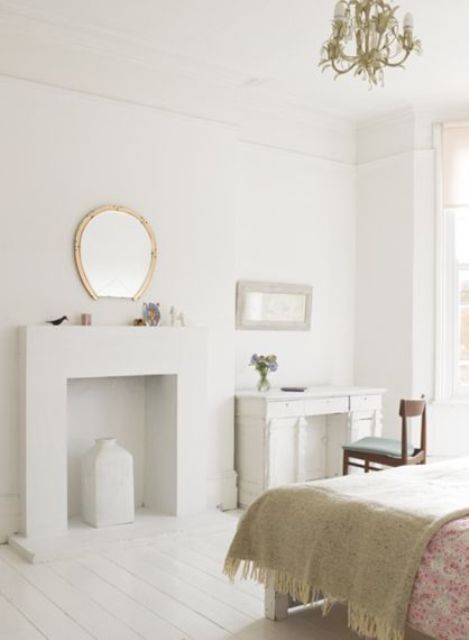 a faux fireplace of cardboard brings a chic and cozy feel to the space and is easy to construct yourself