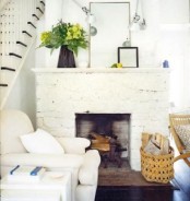 a whitewashed stone non-working fireplace will bring coziness to the space and elegance at the same time