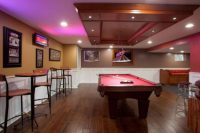 basement game room with neon lights