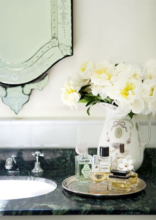 some neutral blooms in an elegant vase make any bathroom refined, chic and very welcoming
