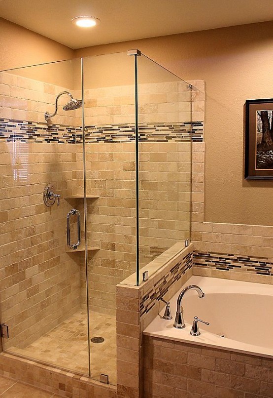 a neutral warm-colored bathroom clad with various tiles, with a pony wall in the shower and a bathtub next to it