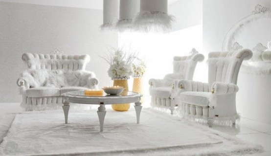 a white living room with whimsical white upholstered furniture, a low coffee table, pendant lamps with faux fur