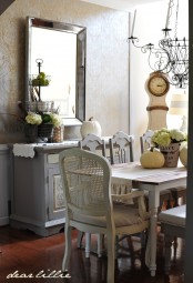 white hydrangeas and white pumpkins will bring a chic vintage fall touch to the dining room
