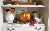 bright faux leaves with a pumpkin and bright fall blooms for simple and durable fall decor