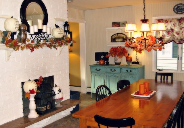 lots of faux fall leaf arrangements, neutral pumpkins and orange ones will last during the whole fall in your dining room